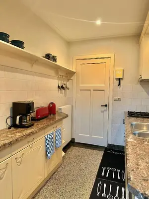 a kitchen with a sink and a counter top at Charming villa,central location,train and bus nearby in Soest
