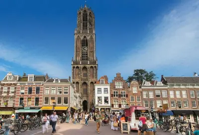 a clock tower in a city with a crowd of people at Charming villa,central location,train and bus nearby in Soest