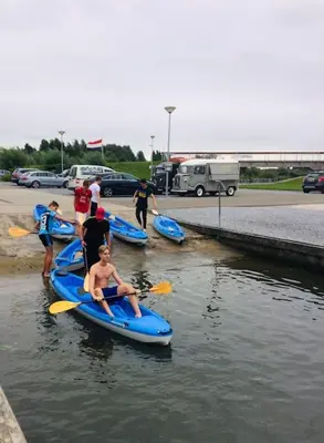 a group of people on kayaks in the water at Trek-in in IJsselstein