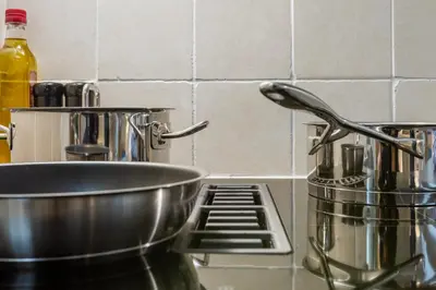 a kitchen counter with a bowl on a stove at Luxurious renovated apartment in Utrecht City center with view on the old canal in Utrecht