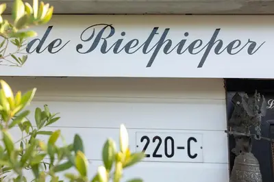 a sign for a sale refrigerator on a door at Woonboot De Rietpieper in Loosdrecht