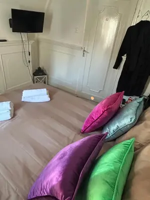 a group of pillows sitting on a bed at Cosy by Mandy in Amsterdam