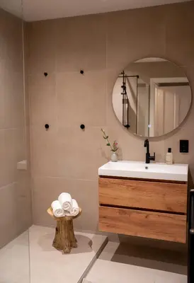 a bathroom with a sink and a mirror at Skinny Bridge Boutique Stay in Amsterdam