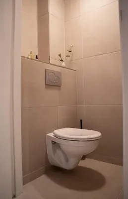 a bathroom with a white toilet in a room at Skinny Bridge Boutique Stay in Amsterdam