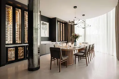 a dining room with a long table and chairs at Hilton Amsterdam Airport Schiphol in Schiphol