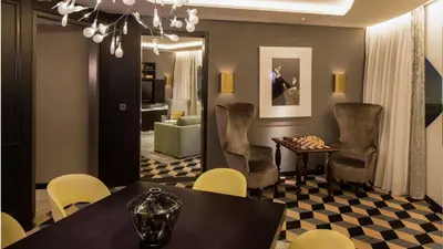 a dining room with a table and chairs at Hilton Amsterdam Airport Schiphol in Schiphol
