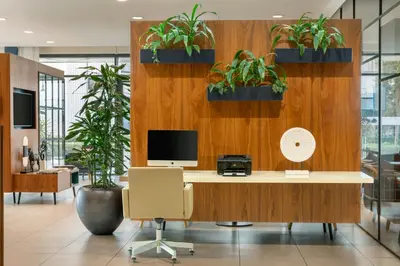 an office with potted plants on a wooden wall at Courtyard by Marriott Amsterdam Arena Atlas in Amsterdam