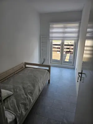 a bedroom with a bed and a window at Smile Home Wijk aan Zee 1 in Wijk aan Zee