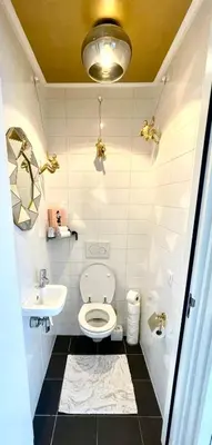 a bathroom with a toilet and a sink at Luxury City Center apartment with Canal view 1 kingsize bed and 1 sleeping sofa in Amsterdam