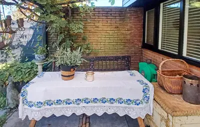a table with a white table cloth on a patio at Nice Home In Warmenhuizen With Wifi in Warmenhuizen