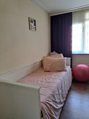 a bedroom with a bed with two pillows on it at Cosy Apartment in Hilversum in Hilversum