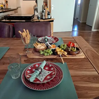 a table with plates of food on top of it at Cosy Apartment in Hilversum in Hilversum