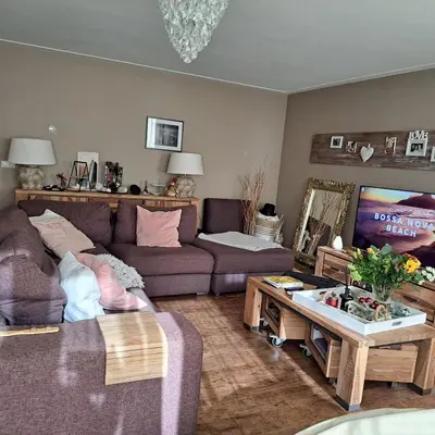 a living room with a couch and a table at Cosy Apartment in Hilversum in Hilversum