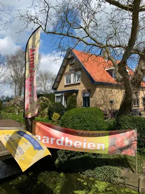 a sign in front of a house at B&B Dol - Fijn in Benningbroek