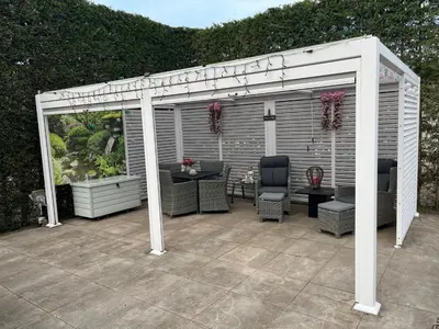 a pavilion with a table and chairs on a patio at B&B Dol - Fijn in Benningbroek