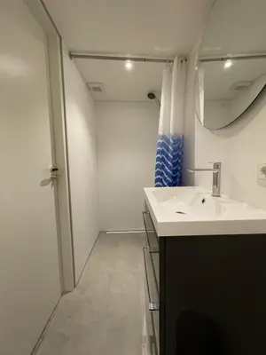 a bathroom with a sink and a mirror at Forecastle KL in Amsterdam