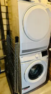 a washing machine with its door open in a room at Dune Lagoon in Egmond aan den Hoef