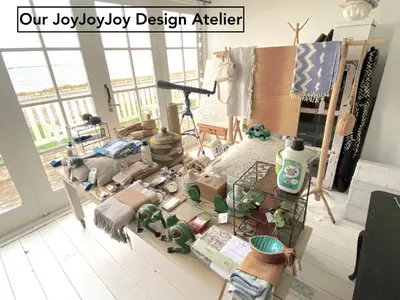 a room with a table filled with lots of toys at JoyJoyJoy the Red Sun ecolicious studio in the historic Canalhouse Tropics at the Canals from 1729 in Amsterdam