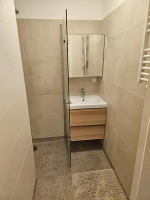 a bathroom with a sink and a mirror at The Amsterdam - South Apartment in Amsterdam