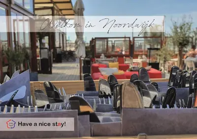 a group of chairs sitting in front of a patio at Have a nice stay! - Ruim appartement de Molen in Noordwijk