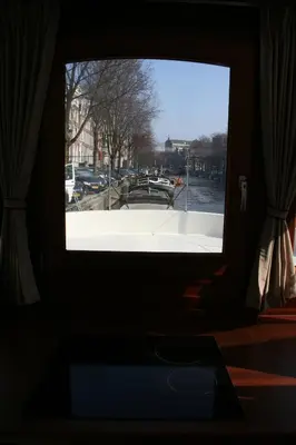 a window in a room with a view of a boat at Prinsenboot in Amsterdam