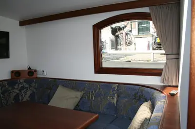 a living room with a couch and a table at Prinsenboot in Amsterdam