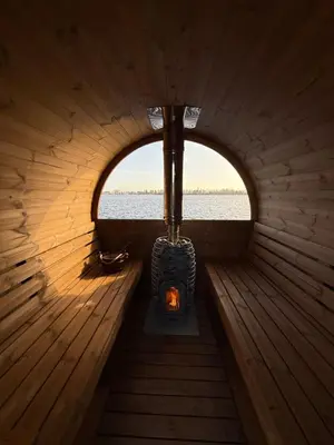 an inside view of a sauna with a fireplace at Villa Perla Mare - Sauna Experience - On a lake near Amsterdam in Vinkeveen