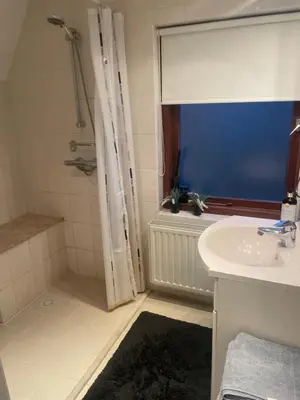 a bathroom with a sink and a shower at 1-2 P Room near Airport AMS freeparking in Roelofarendsveen