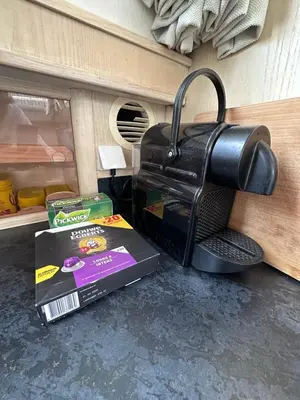 a coffee maker and a box on the floor at Luxury Houseboat in Amsterdam