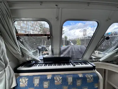 a piano sitting in the back of a boat at Luxury Houseboat in Amsterdam