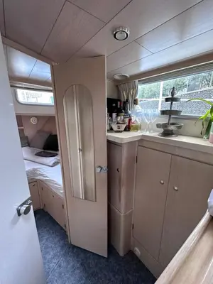 a small kitchen with a sink and a counter at Luxury Houseboat in Amsterdam