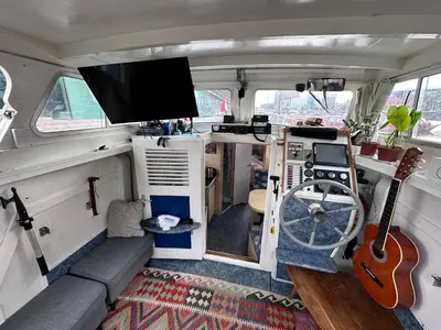 a music van with a tv and a guitar at Luxury Houseboat in Amsterdam