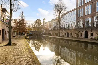 a canal in the middle of a city with buildings at Beautiful canal apartment in Utrecht for 4 persons in Utrecht