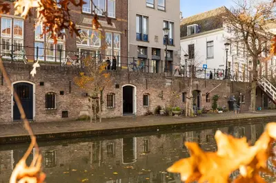 a row of buildings next to a canal at Luxurious canal apartment in Utrecht A Location in Utrecht