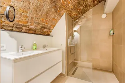 a bathroom with a sink and a shower at 2 Luxurious canal apartments in Utrecht in Utrecht