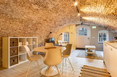 a kitchen and dining room with a table and chairs at 2 Luxurious canal apartments in Utrecht in Utrecht