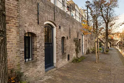 a brick building with a door on a street at 2 Luxurious canal apartments in Utrecht in Utrecht