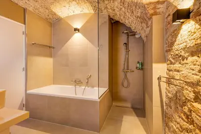 a bathroom with a shower and a bath tub at 2 Luxurious canal apartments in Utrecht in Utrecht