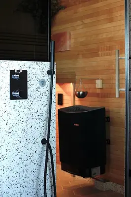 a television sitting in a room with a wall at Luxe Wellness Suite Zaandam - Amsterdam in Zaandam