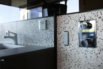a public bathroom with a sink and a mirror at Luxe Wellness Suite Zaandam - Amsterdam in Zaandam