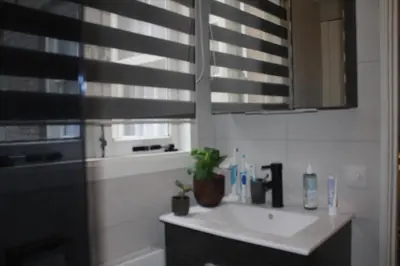 a bathroom with a sink and a mirror at Cozy Apartment in the Centre of Amsterdam in Amsterdam