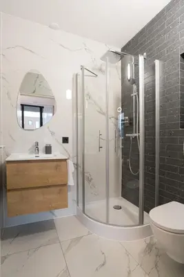 a bathroom with a shower and a sink and a toilet at LevelUp Amsterdam in Amsterdam