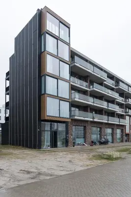 a tall black building with a lot of windows at LevelUp Amsterdam in Amsterdam