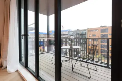 a balcony with a table and chairs at LevelUp Amsterdam in Amsterdam