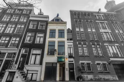 a group of tall buildings on a street at Canalview Amsterdam in Amsterdam