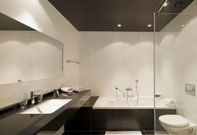 a bathroom with a sink and a toilet and a shower at Van der Valk Hotel Houten Utrecht in Houten