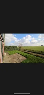 a view of a field from a window of a house at Vakantiehuis Medemblik polder in Opperdoes