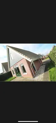 a house is shown in two pictures with at Vakantiehuis Medemblik polder in Opperdoes
