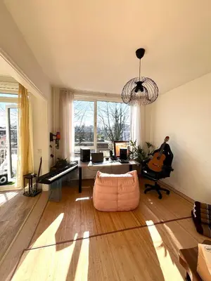 a large living room with a couch and a chair at Stunning artist zen guest suite at heart of Amsterdam in Amsterdam