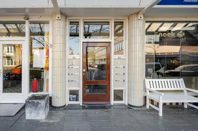 a store front with a bench in front of a door at Stunning artist zen guest suite at heart of Amsterdam in Amsterdam